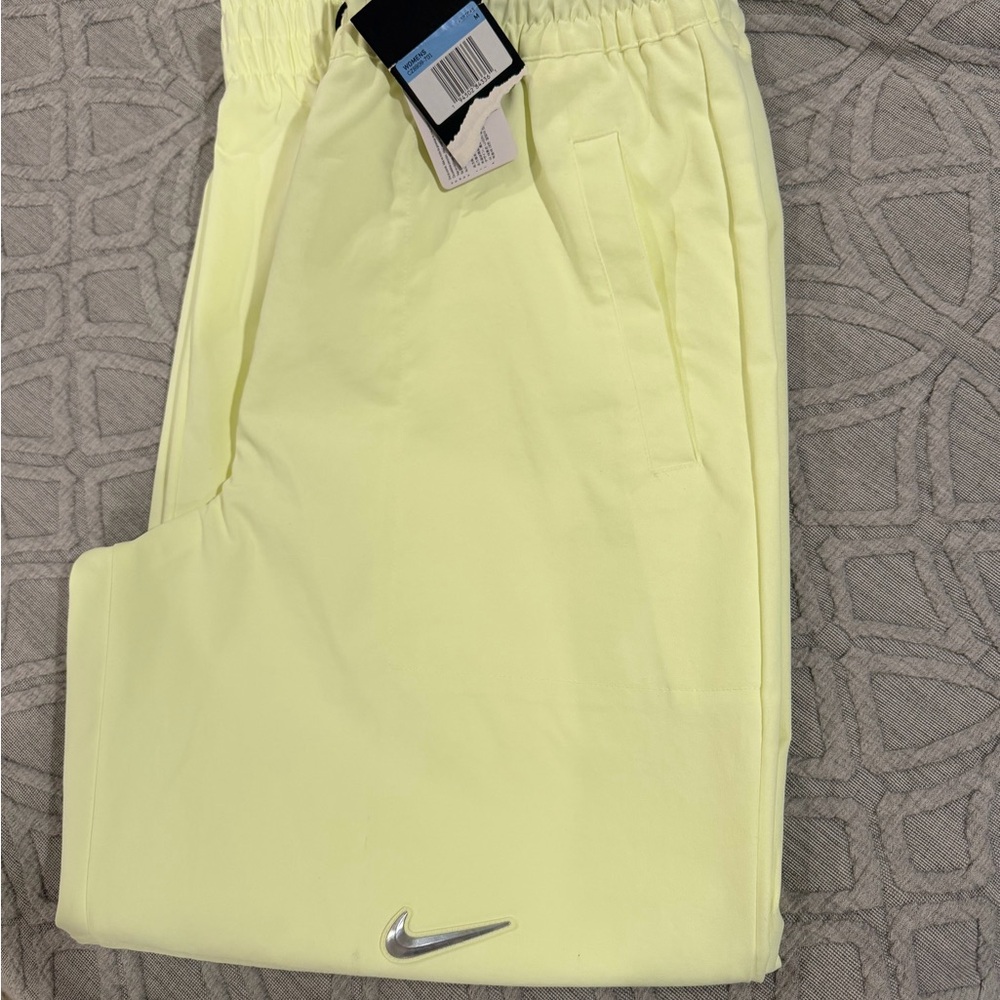 Nike Pale Yellow Performance Joggers with Silver Swoosh